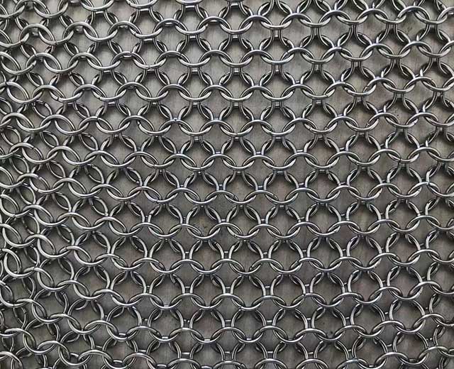 What is the material of the metal mesh curtain?